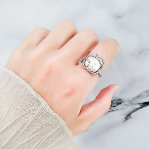 French vine S925 silver open ring featuring an elegant irregular pearl on woman's hand