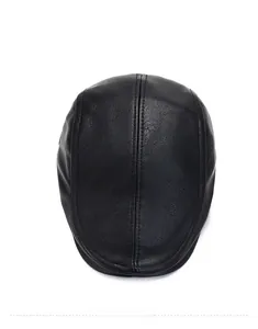 Top down view of black faux leather flat cap with stitching detail and textured finish