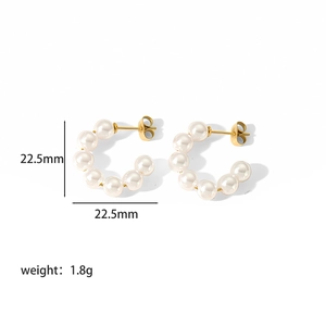 Detailed view of C-shaped pearl earrings showing 22.5mm size and 1.8g weight specs