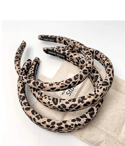 Macro detail of handmade leopard print fabric headbands with high-quality interior stitching