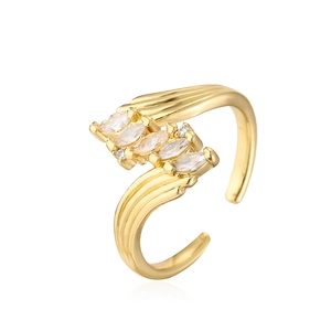 Detail of 18K gold plated ring with marquise zirconia in a bypass geometric design