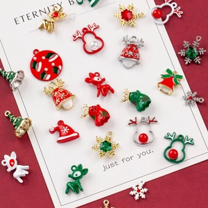 Detailed view of assorted Christmas charms including reindeer, bells, and snowflakes on red background