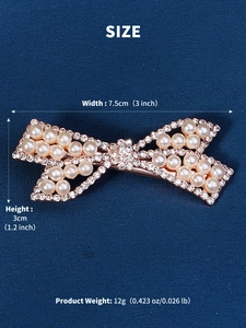 Detailed view of rhinestone and pearl bow hair clip with product dimensions and weight