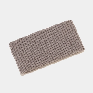 Close-up of ribbed knit texture on a stretchy brown winter headband for sports