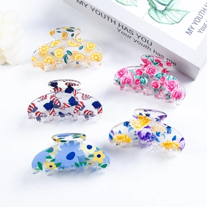 Five pack of colorful 8cm butterfly claw clips with lemon, floral, and grid patterns