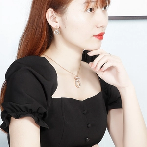 Rose gold stainless steel jewelry set with double-ring diamond-studded necklace and earrings