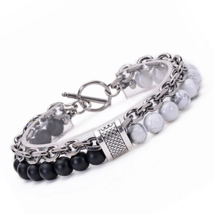 Detail of double-layer men's bracelet with black lava stone, white marble beads, and T-bar clasp