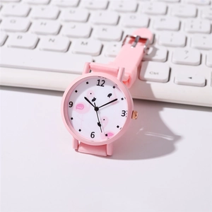 Pink flamingo cartoon kids watch with silicone strap and analog white dial on white background