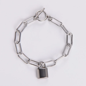 Polished silver paperclip chain bracelet with heart lock charm and OT toggle clasp