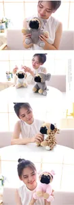 Detail of plush Shar Pei dog toys in koala, rabbit, leopard, and pig costumes