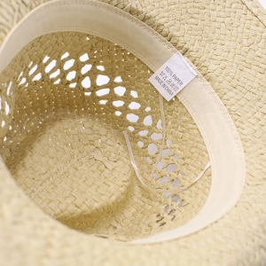 Detail of the 100% paper straw hat interior with sweatband and adjustable drawstring