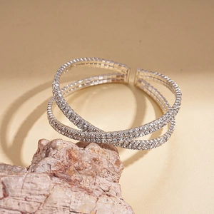 Macro detail of silver layered rhinestone bracelet with high-shine crystal pave setting