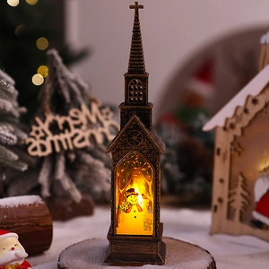 Macro detail of bronze Christmas church lantern with glowing snowman scene and holiday lights