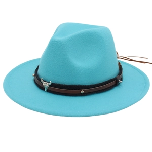 Detail of teal fedora hat featuring a leather band with rivets and silver bull head ornament