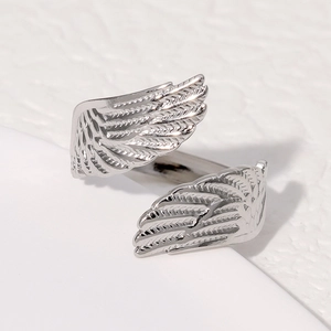 Polished stainless steel angel wing ring in silver finish with detailed feather textures