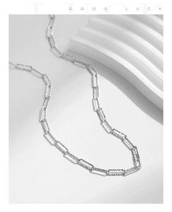 Close-up of S925 silver link chain necklace featuring irregular hammered texture details