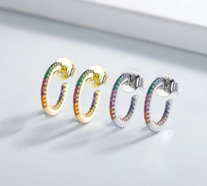 Close-up of S925 hallmark on colorful zircon earrings in gold and silver plating