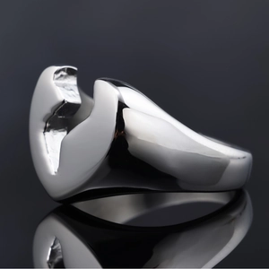 Polished stainless steel wrench shaped ring with industrial style on reflective base