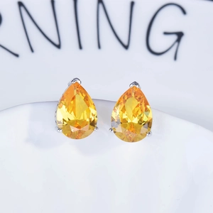 Elegant pair of pear-cut yellow gemstone earrings set in polished silver metal