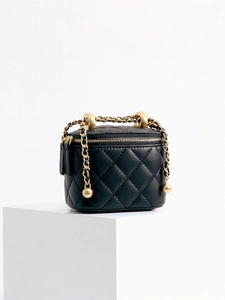 Quilted black leather crossbody bag with golden metal ball chain strap on white background