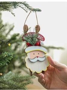 Detail of wooden Santa Claus ornament on a skateboard for Christmas tree decor