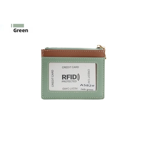 Detail view of jade green RFID blocking card holder with zipper and textured PU leather