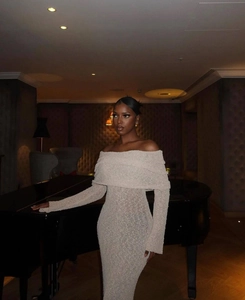 Detail of off-shoulder long sleeve knitted dress in oatmeal beige slim fit design
