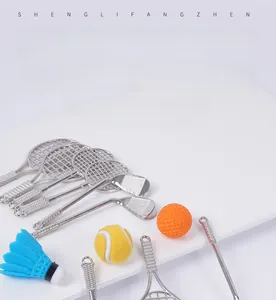 Detailed view of mini alloy sports racket models including tennis and golf club pendants