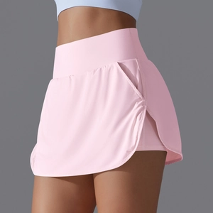 Detailed view of pink tennis skort with high waistband and functional side pocket