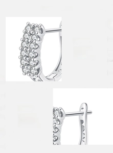 Detailed macro view of S925 sterling silver U-shaped hoop earrings with dual row zircons