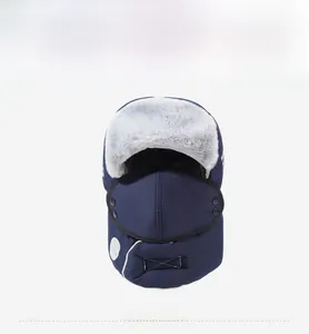 Deep blue winter trapper hat with gray faux fur lining and matching face mask detail