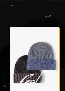 Detail of chunky knit winter beanies in grey-blue and dark coffee with thick rolled edges