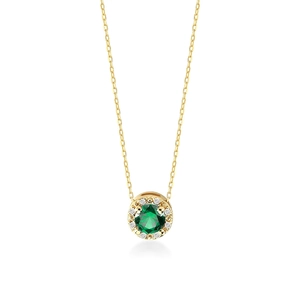 Detailed view of a gold-plated round necklace with green emerald-cut cubic zirconia and small diamonds