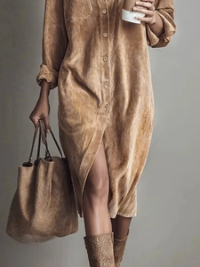 Detailed texture of tan corduroy long sleeve shirt dress with button-down front style