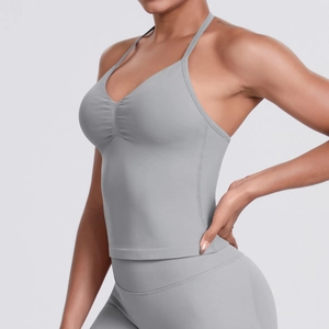 Detail of grey seamless yoga tank top showing fine stitching and ribbed texture fabric