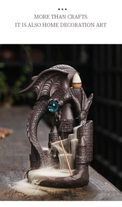Macro detail of a dragon castle backflow incense burner showing smoke flowing over steps