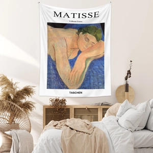 Artistic detail of Matisse The Dream tapestry hanging in a cozy minimalist bedroom setting