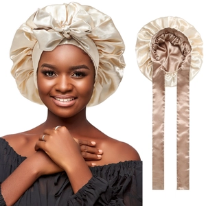 Detailed view of champagne silk satin bonnet with adjustable long straps for hair care