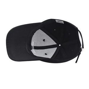 Detail view of cotton baseball cap interior featuring stitching and adjustable strap