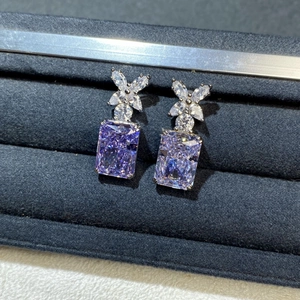 Elegant S925 silver stud earrings featuring purple radiant cut gems and floral design