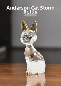 Detailed view of the Bastet cat storm glass bottle with gold accents and crystals