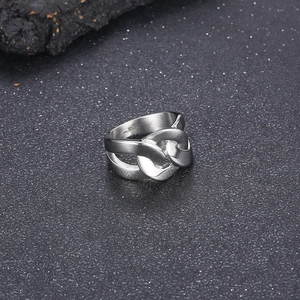 Detailed macro shot of silver stainless steel ring with interlocking chain link design