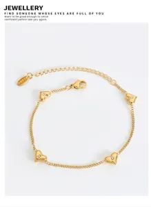 Detailed macro view of heart-shaped gold stainless steel bracelet with zircon inlay