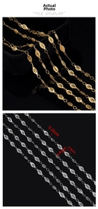 Detail view of gold and silver oval link chains with precise technical measurements