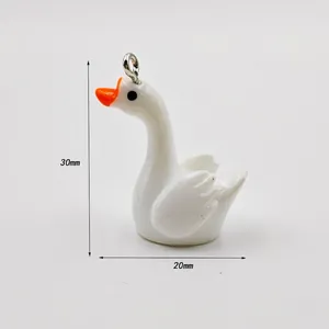 Detailed view of a white acrylic swan pendant with dimensions 30mm height and 20mm width