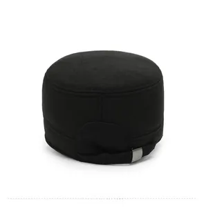 Detail view of the back of a black military cap with adjustable silver metal buckle
