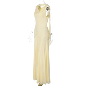 Detail of light yellow backless bodycon dress with draped neckline and side ruching