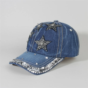 Detail shot of denim baseball cap with rhinestone star patches and sparkling brim decor