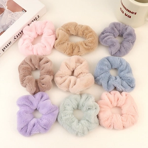 Set of 9 soft plush scrunchies in colorful macabre pastel colors for women