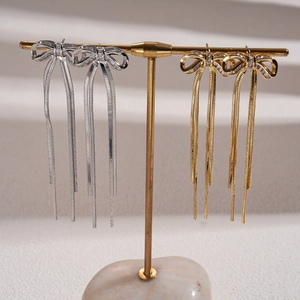 18K gold plated bow earrings with dangling tassels and sparkling cubic zirconia stones